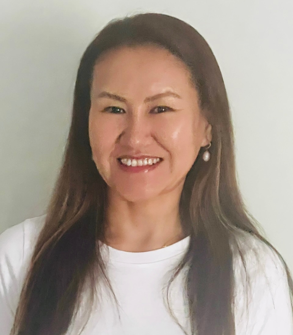 Portrait of a smiling Phil Patterson Inc. employee in a white shirt